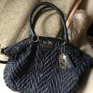 Navy Coach large crossbody satchel.